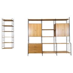 three shelves with wooden doors and drawers on each shelf, one is open and the other has