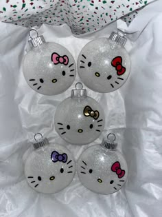 hello kitty christmas ornaments are on display in a box