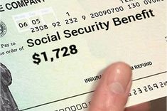 a person holding up a social security benefit check for $ 1, 728 per dollar