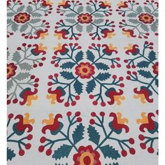 a white and red rug with flowers on it