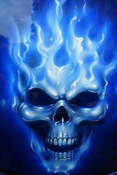 a white skull with blue flames on it's face