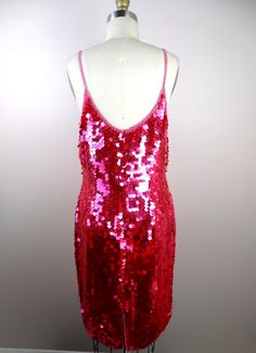 "This is another sparkly sequined party dress! It's fully embellished with bright pink paillette sequins. It's in excellent condition! Bust - 34\" Waist - 26\" Hips - 38\" Length - 37\" This dress comes from a pet-free and smoke-free home. If you would like more info or have any questions, please don't hesitate to ask!" Festive Fitted Contrast Sequin Dress, Pink Sequin Glitter Dress For Holiday, Party Season Pink Dress With Contrast Sequin, Pink Sequin Dress With Glitter For Holidays, Holiday Pink Sequin Dress With Glitter, Pink Sequin Fabric For Night Out And Holiday, Pink Sequined Dress For The Holidays, Holiday Pink Sequin Glitter Dress, Pink Dress With Contrast Sequins For Party Season