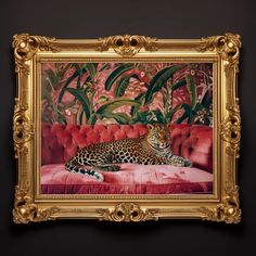 a painting of a leopard laying on a red couch