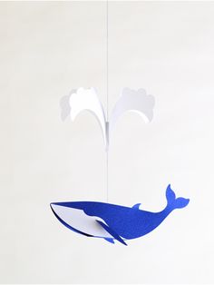 a paper whale hanging from the ceiling