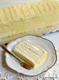 a piece of cake sitting on top of a white plate next to a knife and fork