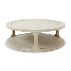 a round coffee table with two tiered shelves on each side and an oval top