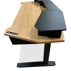 a laptop computer sitting on top of a wooden desk