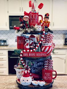 a stack of christmas items on top of a kitchen counter