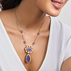 Description: Introducing our exquisite pendant necklace, a true embodiment of elegance and grace. At its center, a captivating amethyst-colored stone is encircled by shimmering moissanites and zircons, creating a stunning focal point. Below, a beautiful drop stone hangs delicately, adding a touch of sophistication and allure to the design. This necklace is a timeless masterpiece, perfect for adding a dash of glamour to any outfit. Elevate your style with this enchanting pendant necklace, sure to Luxury Silver Gemstone Temple Necklace, Jewellery Designing, Ethereal Jewelry, Gold Temple Jewellery, Designer Diamond Jewellery, Victorian Pendants, Edgy Jewelry, Bridal Jewellery Design, Fancy Jewellery Designs