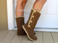 a woman's legs wearing brown crocheted boots with buttons on the side