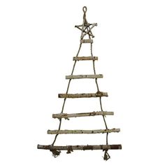 a wooden christmas tree made out of sticks and branches with an ornament hanging from the top