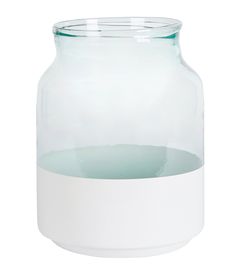 a glass jar with water inside on a white background