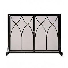 an iron and glass fireplace screen with decorative designs on the front, side and back panels