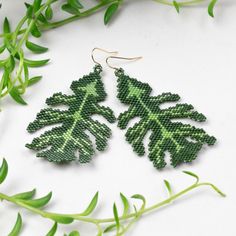 Oak Leaf Earrings made of Glass Beads Earthy Handwoven Jewelry For Gifts, Handmade Nature-inspired Dangle Beaded Earrings, Handmade Leaf-shaped Nature-inspired Earrings, Handmade Green Leaf-shaped Earrings, Unique Handwoven Green Earrings, Handmade Green Leaf-shaped Jewelry, Nature-inspired Green Jewelry With Ear Wire, Green Artisan Round Bead Earrings, Earthy Green Drop Earrings