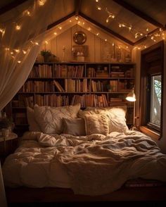 a bed with lots of books and lights on it