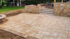 an outdoor patio with fire pit and seating area