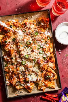 a pizza sitting on top of a pan covered in cheese