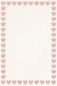 a white paper with pink hearts in the shape of a frame on top of it