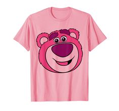 a pink t - shirt with a cartoon bear's face