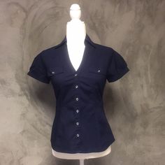 Express Essential Stretch Navy Blue Button Up Buckle Short Sleeve Blouse Nwot Size: Xsmall Shop With Confidence! Clean And Smoke Free Home And Boutique! Ships Same Day Or Next Business Day! All Items Are Handled And Shipped With Tlc! Blue Button Up, Blue Button Up Outfit, Organized Clothes, Hotel Closet, Sleeve Shirt Outfit, Blue Collared Shirt, Thrift Board, 90’s Outfits, Clothes Board