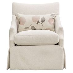 a white chair with a flowered pillow on it