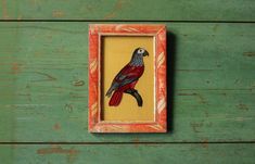 a bird painted on the side of a wooden frame