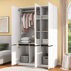 an open closet with clothes on hangers and other items in the room next to it