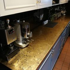 a kitchen counter with a coffee maker on it