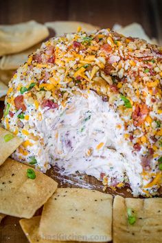 a close up of a cheese ball surrounded by crackers