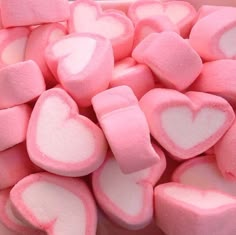 pink and white heart shaped marshmallows in a bowl