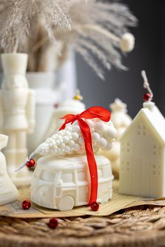 some white ornaments are sitting on a table