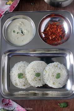 an assortment of food items on a metal tray