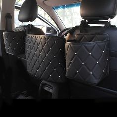 the back seats of a car with studded bags in it's rear seat