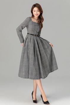 "The flared silhouette adds a feminine touch, making it suitable for various occasions. The wearer pairs it with a chic black handbag, completing the ensemble. Overall, this dress exudes understated elegance and style.  Details * 15% linen , 45% cotton , 40% polyester * Classic and beautiful plaid  * Fitted waist to show off your curves * Square neckline * Long sleeves  * Side zipper in the right side * Pleated on the waist * Midi dress * Wash by hand or machine with cold water MODEL SIZE Bust 8 Square Dress Outfit, Gray A-line Winter Dresses, Elegant A-line Vintage Winter Dress, Retro Dress Outfits 90s, Fitted Spring Midi Dress With Wide Hem, Spring Fitted Midi Dress With Wide Hem, Fitted Midi Dress With Wide Hem For Spring, Vintage A-line Dress For Fall Evening, Vintage A-line Evening Dress For Fall