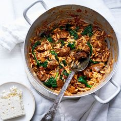 a large pot filled with rice and meat