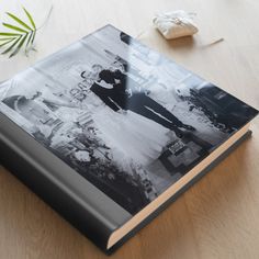 an open book sitting on top of a wooden table