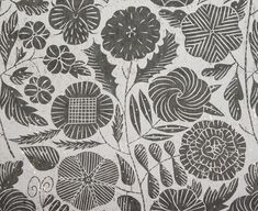 an intricately designed wallpaper with flowers and leaves in black on white paper, possibly from the late 19th century