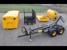 the trailer is parked next to other equipment