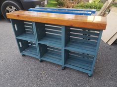 a wooden table sitting on top of a parking lot