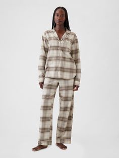 Soft cotton flannel pajama shirt and pants set.  Notch collar, button front.  Long sleeves.  Elasticized waist at PJ pants.  Assorted allover prints.  Note: This pajama set comes pre-wrapped and ready to gift for the holiday season.  Fit: Relaxed.  An easy silhouette throughout.  Models wearing Gap Teacher Pajamas Day Outfit, Christmas Morning Pajamas, Fall Pajamas, Hosting Christmas Dinner, Winter Pjs, Flannel Pjs, Winter Nyc, Shirt And Pants Set, Easy Silhouette