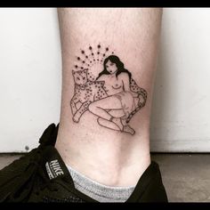 a tattoo on the leg of a woman