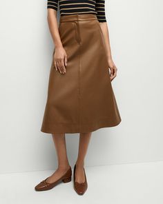 The classic A-line skirt, coated to look like leather. Equal parts polish and edge, this high-waisted midi skirt has a beautiful drape and movement with each step. Style the Louise with a silk top and kitten heels to play up the feminine factor.100% Polyurethane, 95% Coated Rayon, 5% ElastaneLining: 100% PolyesterDry clean onlyStyle #2411LT5130438