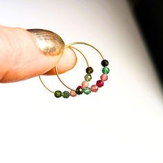 Look great wearing these small 14k gold filled faceted tourmaline hoop earrings.  Not only are they beautiful gemstones, they are strong too, and at only 20mm / .75" diameter, these handmade lightweight gold hoops are perfect for everyday wear... just slip them on and go. ■ FREE shipping ■ Ready to ship in 1 business day; Personal gift card upon request ■ Link to my store and additional one-of-a-kind jewelry: https://finefindingsco.etsy.com PHOTOS Pictures are deliberately taken up close to show Personalized Gift Cards, Beautiful Gemstones, Small Gold Hoops, Gold Filled Hoops, Handmade Jewelry Gift, Gold Hoops, Jewelry Earrings Hoops, Gemstone Earrings, Earrings Handmade