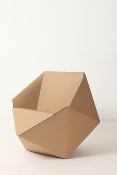 an empty box sitting on top of a white table