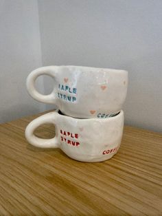 two coffee cups sitting on top of each other