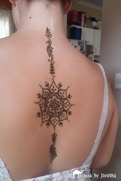 a woman with a tattoo on her back