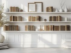 a white room with bookshelves and vases