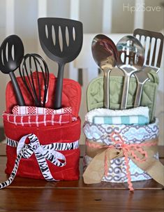 kitchen utensils are sitting in a holder on a table next to each other