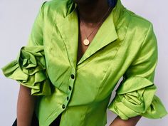 - 100% Polyester - Fully lined (lime green) - Shiny lime green colour - Unique elaborate ruffles on sleeve cuffs - Shiny black diamond cut buttons - Darts at front and back to create a fitted silhouette  - Feels soft and easy to wear - Lightly padded shoulders (can be removed) - Gorgeous statement jacket Label: DDNY Condition: Very Good/ Excellent condition - The bottom button is missing but not very noticeable and could be replaced. Otherwise in fabulous condition. Measurements laid flat (appro Fitted Long Sleeve Light Green Top, Fitted Light Green Long Sleeve Top, Fitted Green Top For Formal Occasions, Green Fitted Top For Formal Occasions, Fitted Green Top For Wedding, Green Long Sleeve Top For Wedding, Green Formal Blouse For Spring, Elegant Green Top For Wedding, Fitted Green Blouse