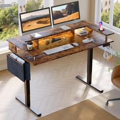 a computer desk with two monitors and keyboard on it in front of a large window